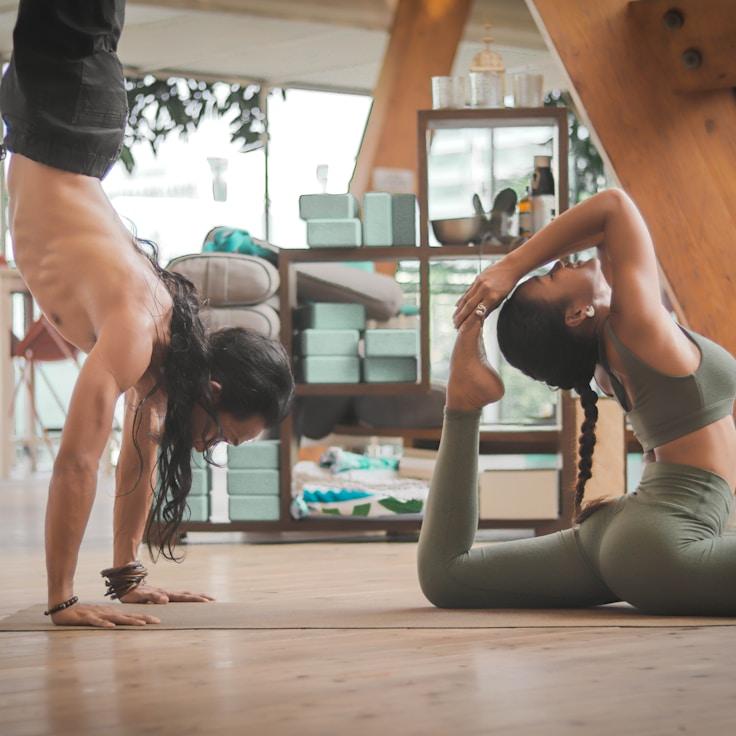 Women in a fitness class doing stretching and mobility exercises